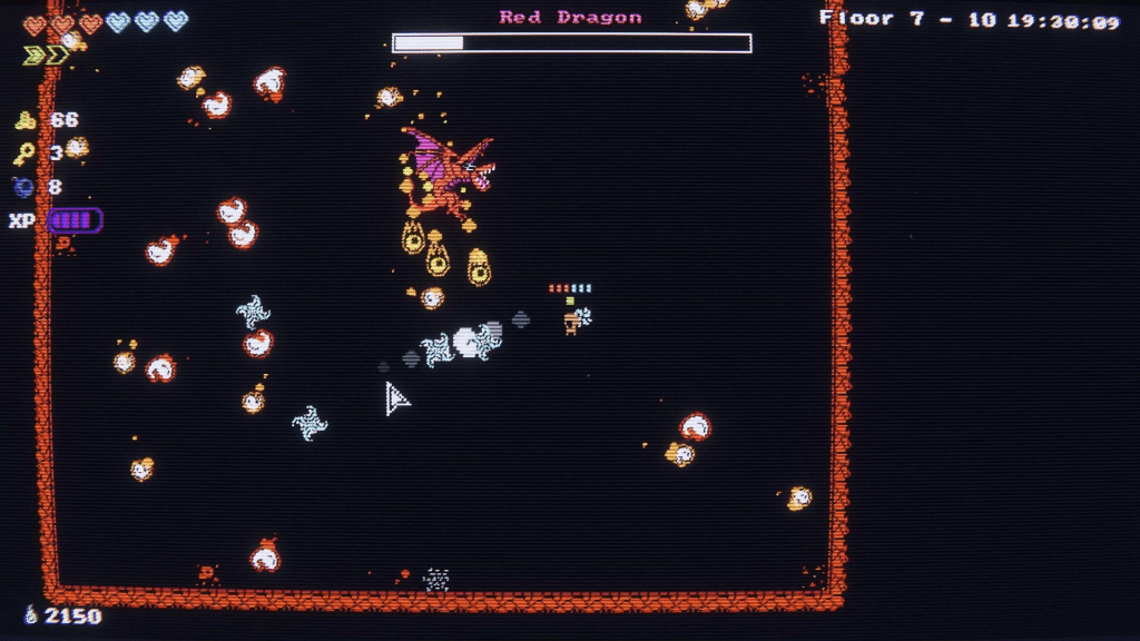 An image showing some game play from Tiny Rogues. A boss fight with the dragon boss, who was quite tough.
